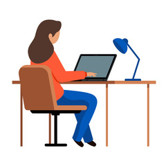 Girl sitting in a chair at the table and typing. A young woman working in the office at the computer.