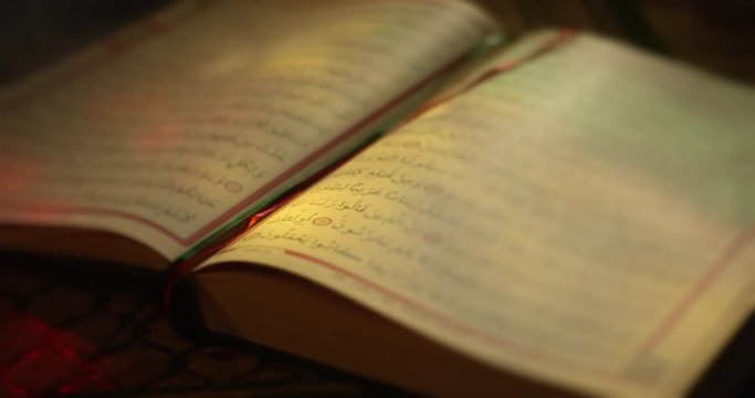 Close up of beautifully illustrated book with islamic writing