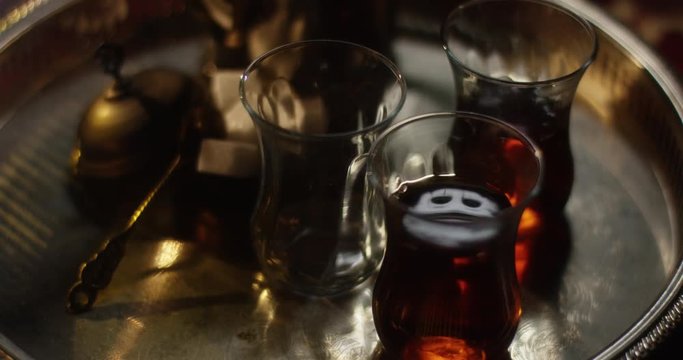 Steaming tea in oriental setting vibrating slightly