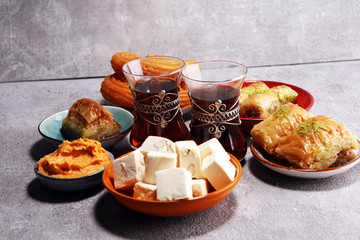 Middle eastern or arabic dishes and assorted meze, concrete rustic background. sambusak. Turkish...