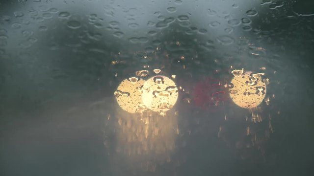 Rain drops on car wind windshield and wipers. Bad weather concept