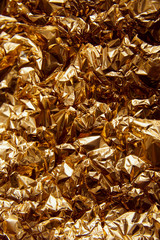 crumpled golden foil with glares and sparkles
