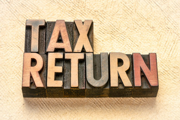 tax return banner in letterpress wood type