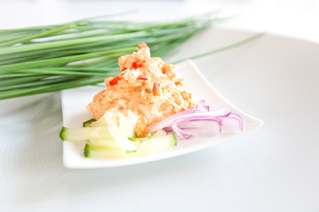Liptauer cheese preparation on bright plate over white background. Clean eating, dieting, vegetarian, healthy food concept