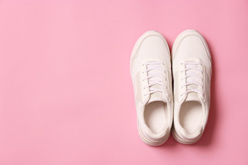 women's sneakers on a colored background top view. Women's shoes.