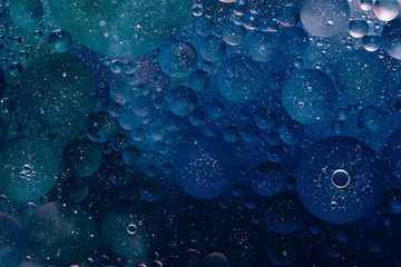 Photo of water oil bubble macro abstract background flow liquid dark blue aqua black colors