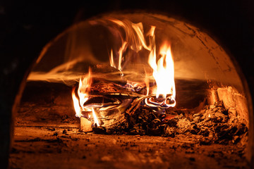 Firewood, burning into the brick stove