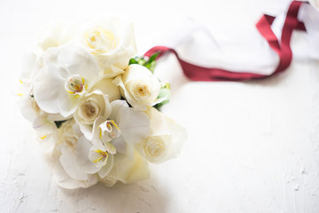 Obraz na płótnie Canvas Wedding bouquet with white roses and orchids