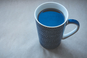 Top view of coffee cup on a wood background with copy space.