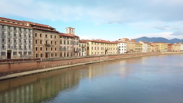 Panning of Arno river and Santa Maria della Spina, a gothic church in Pisa IT