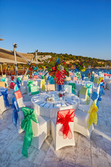 Festive served sea view terrace restaurant for corporate banquet or wedding