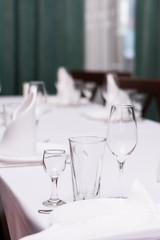 dinner table for dinner and breakfast plate glass glass spoon spoon tablecloth and tableware