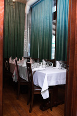 restaurant interior dinner service for dinner and breakfast glass plate glass spoon spoon tablecloth and dishes