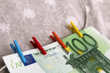 euro banknotes and clothepins