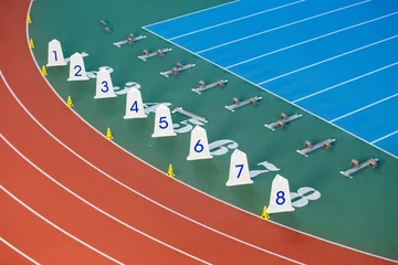 Poster Sprint start line with blocks on track and field © skumer