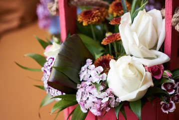 Beautiful bouquet of different flowers on table background with copy space