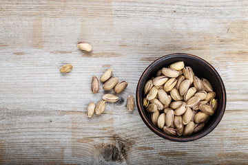 pistachios on wooden background