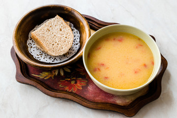 Homemade Potato Pumpkin Soup served with Bread.
