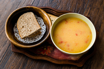 Homemade Potato Pumpkin Soup served with Bread.