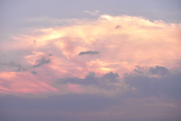Beautiful clouds at sunset. The sun's rays pass through the clouds. 