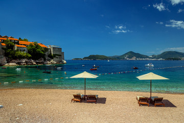 Parasol and a beautiful beach on the Adriatic Sea. Montenegro.