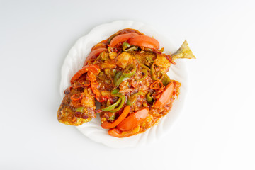 Sweet sour fried fish on white background with selective focus and crop fragment