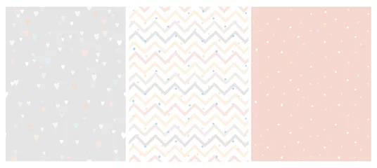 Fototapeten Set of 3 Bright Delicate Chevron, Hearts and Dots Vector Patterns. Irregular Tiny Dots Pattern. Hand Drawn Chevron Designs. White, Gray, Beige and Pink Pastel Design. Cute Nursery Art Patterns. © Magdalena
