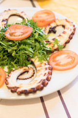 Octopus salad with rocket and tomatoes