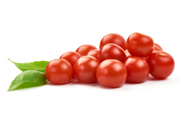 Fresh cherry tomatoes with basil, close-up, isolated on white background