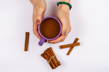 Holding a cup of coffee