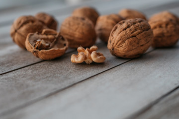 Walnuts on wooden table.