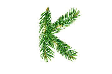 Letter K, English alphabet, collected from Christmas tree branches, green fir. Isolated on white background. Concept: ABC, design, logo, title, text, word