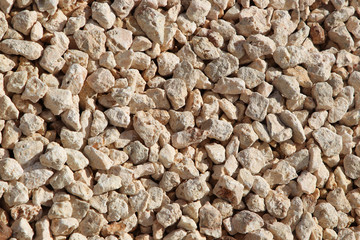 Medium gravel of warm tones background