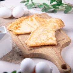 Traditional russian pancakes blini on white background with copy space. Homemade russian thin pancakes blini. Russian food, russian kitchen