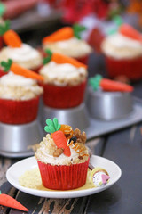 Easter cupcakes baked with carrot decorated with small figures
