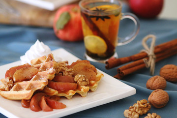waffles sered with walnuts, honey and baked aples