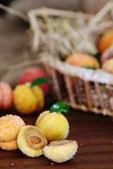 Peach shaped cookies with nut and caramelized milk inside