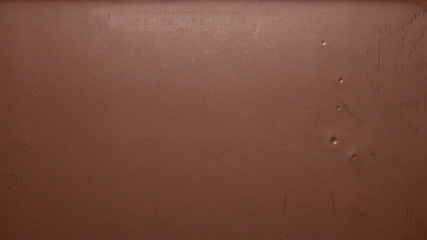 Smooth texture of milk chocolate.Chocolate photo background.