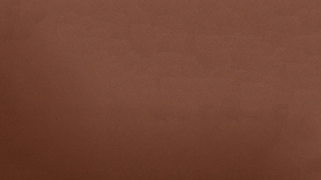 Smooth texture of milk chocolate.Chocolate photo background.