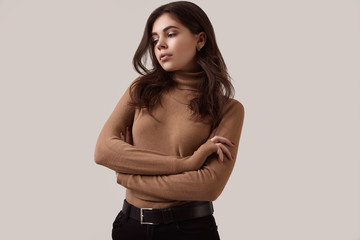 Naklejka premium Fashion brunette woman wearing turtleneck and a gold chain