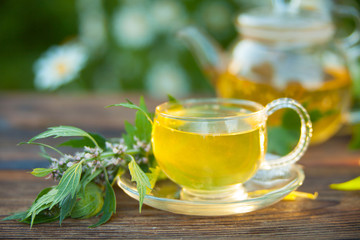 delicious green tea in beautiful glass bowl on table