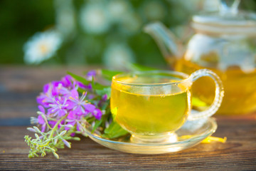 delicious green tea in beautiful glass bowl on table
