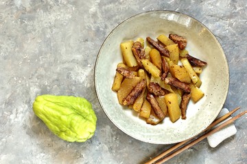 chayote with beef and sesame in asian style. The dish is popular in Asia, especially in Vietnam. recipe with chayote. copy space. place for text. top view