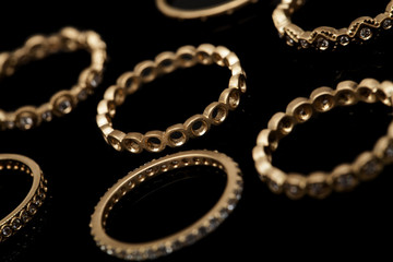 Yellow Luxury Gold Rings on Black Background