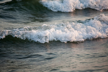 Fototapeta na wymiar Wave and sand closeup