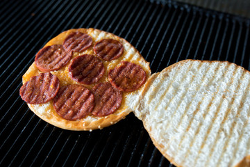 Toast sandwich breakfast with cheese and sausages