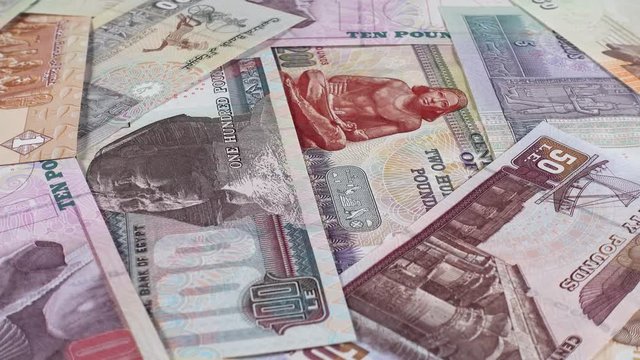 Egypt pound notes slow rotating. Egyptian currency. Low angle. 4K stock video footage