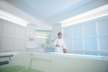 Smiling asian lady ready to have beauty procedure
