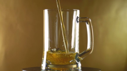 In a large mug that turns into a poured dark beer on a golden background, Oktoberfest