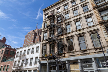 new york Fire escape stairs-downtown back alley architecture-steel and yellow brick background